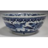 A Chinese blue and white porcelain punch bowl, late 19th century, the exterior painted with a pair