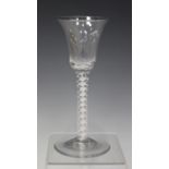 A double series opaque twist stem wine glass, mid-18th century, the bell shaped bowl raised on a