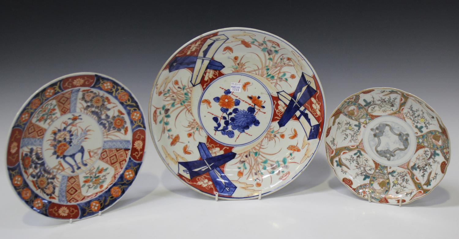 A Japanese Imari porcelain circular dish, Meiji period, painted with segmented panels of flowers and