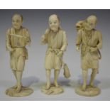 A group of three Japanese carved sectional ivory okimono figures of male workers, Meiji period, each