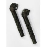 A pair of Chinese archaistic bronze fittings, each cast and pierced cylindrical shaft with slip-on