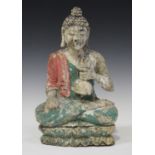 A South-east Asian polychrome carved and painted wood figure of Buddha, modelled seated in