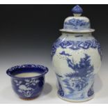A Chinese blue and white porcelain jar and domed cover, modern, the baluster body painted with