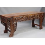 A Chinese hardwood altar table, 20th century, with rectangular panelled top, the front apron