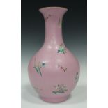 A Chinese famille rose enamelled pink ground porcelain vase, mark of Qianlong but possibly