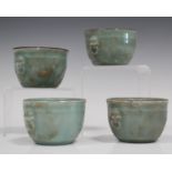 A set of four Chinese celadon glazed porcelain small pots, 20th century, each of circular jardinière