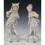 A pair of Gille French porcelain figures of children, late 19th century, modelled by Charles Baury