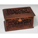 A Chinese Canton sandalwood rectangular box and cover, late Qing dynasty, the hinged lid carved in