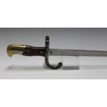 A French 1874 model Gras bayonet, dated 'Avril 1877', blade length 52cm, with steel sheath and