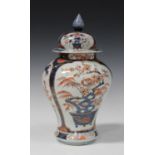 A Japanese Imari porcelain jar and domed cover, early 18th century, of baluster form, painted and