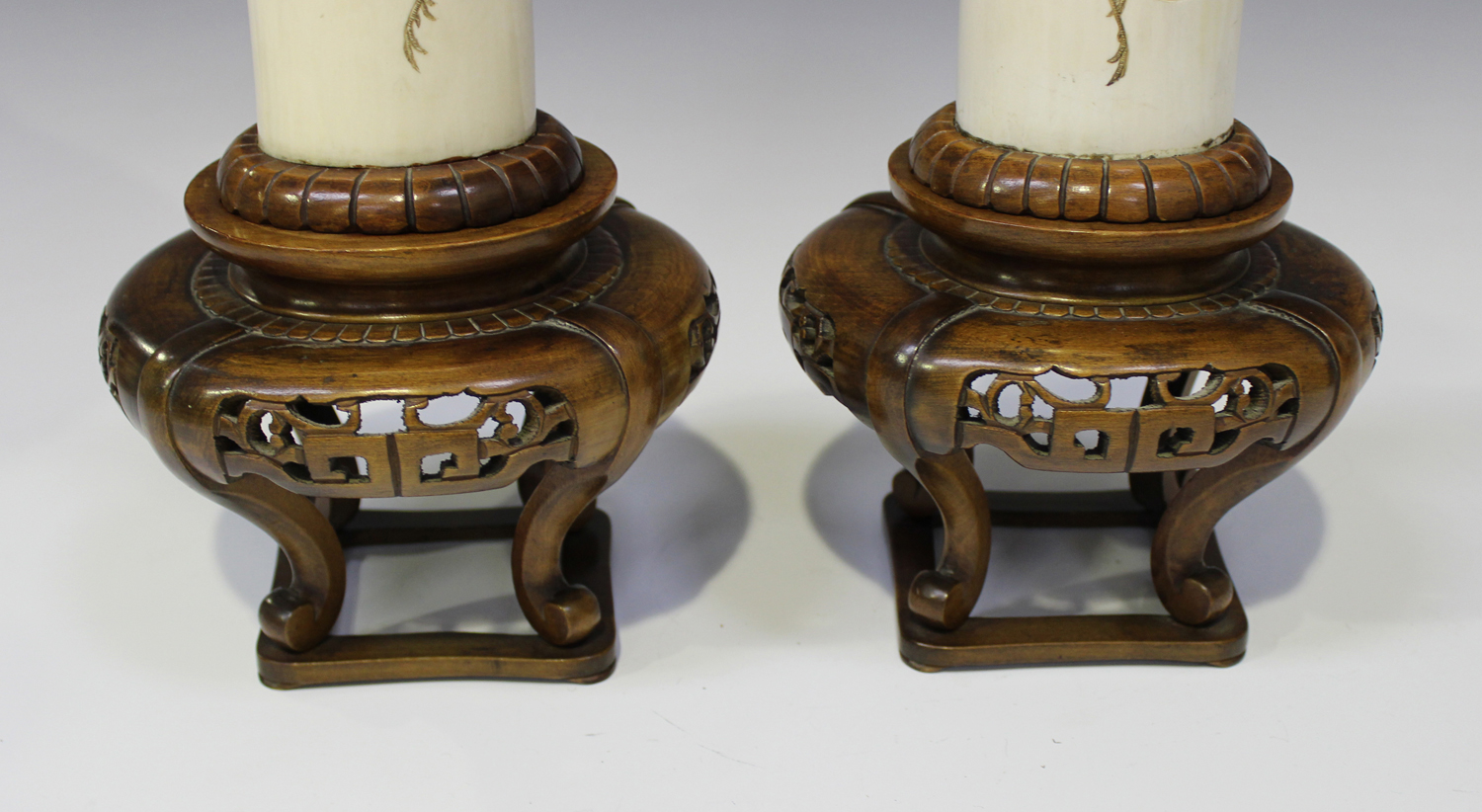 A pair of Japanese ivory tusk vases and wood stands, Meiji period, each tusk section incised and - Image 2 of 3