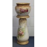 A Doulton Burslem pottery blush ground jardinière and stand, late 19th/early 20th century, the