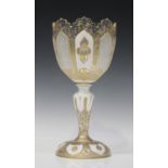 A Bohemian white overlay and cut goblet shaped glass vase, late 19th century, the cup shaped bowl
