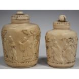Two Chinese Canton export ivory snuff bottles and cover, mid-19th century, each of oval form, carved