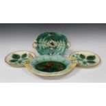 A group of Continental majolica serving dishes and plates, late 19th century, including a two-