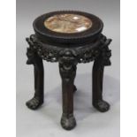 A Chinese hardwood stand, late 19th century, the circular top inset with a rouge marble panel, the