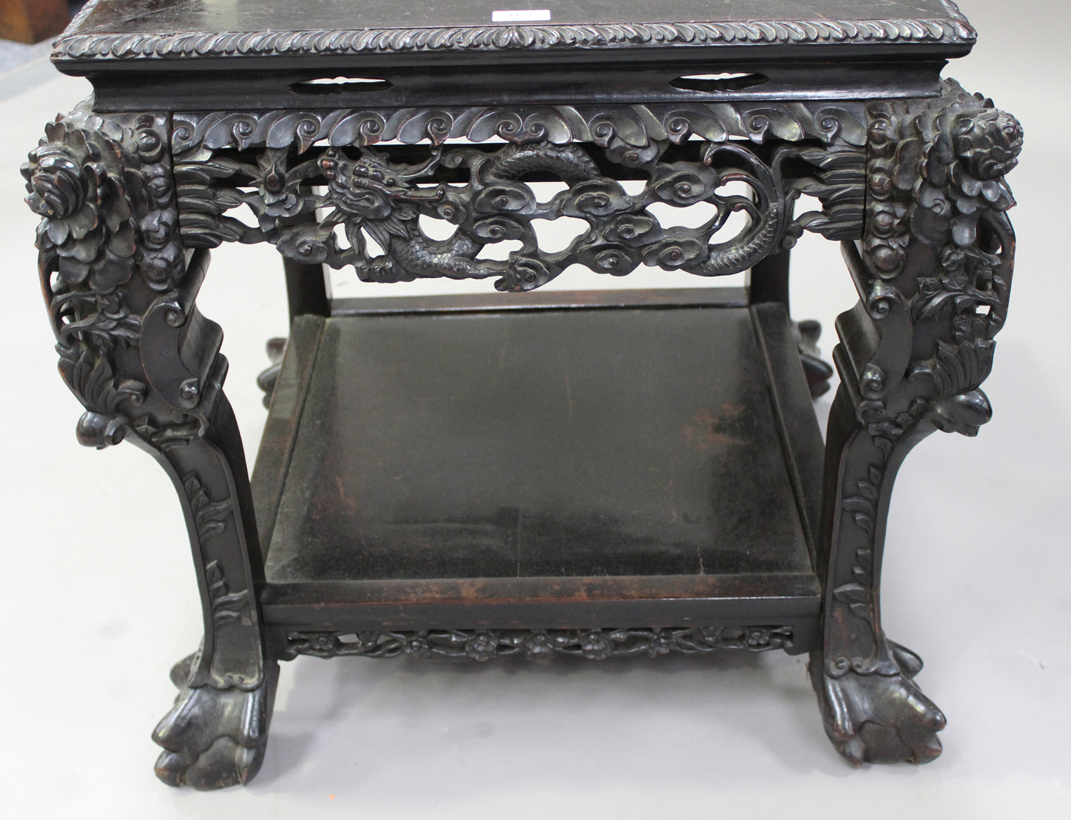 A Chinese carved hardwood stand, late 19th/early 20th century, the square panelled top with a carved - Image 4 of 7