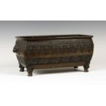 A Chinese brown patinated bronze planter, late Qing dynasty, the swollen rectangular body cast in