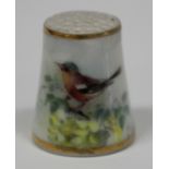 A Royal Worcester porcelain thimble, circa 1935, painted by Powell, signed, with a chaffinch perched