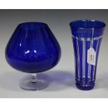 A collection of assorted blue glass, including a Nachtmann flashed vase of gently flared form, a