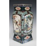 A Japanese Kutani porcelain vase, Meiji period, of lozenge section, painted with panels of birds and