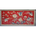 A Chinese silk embroidered rectangular panel, worked in coloured threads with two birds amidst