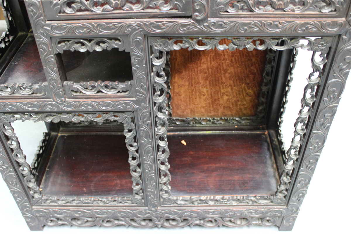 A Chinese carved hardwood display cabinet, late 19th/early 20th century, the rectangular panelled - Image 2 of 4