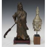 A Chinese bronze figure of Guandi, 20th century, the god of war modelled standing, holding a dao (