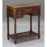 A Chinese hardwood dressing table, early 20th century, the central hinged top revealing a folding