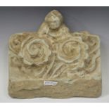 A South-east Asian pottery roof tile/frieze section, moulded in relief with a figurehead and