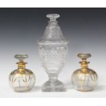 A pair of Art Nouveau gilded and enamelled glass scent bottles and stoppers, each globular body