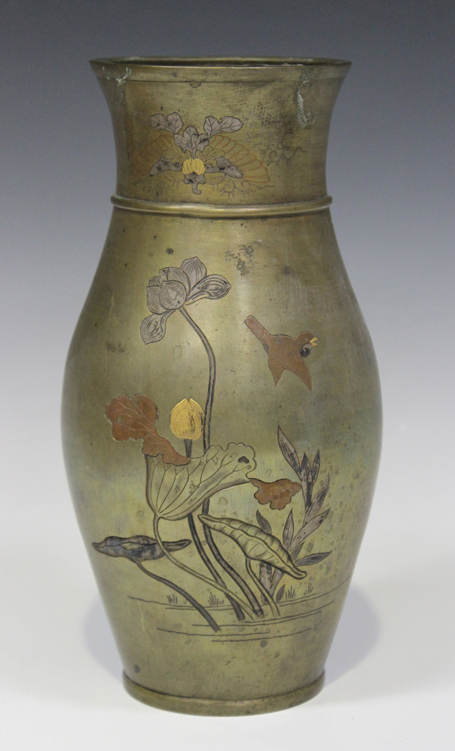 A Japanese mixed metal inlaid bronze vase, Meiji period, the ovoid body and flared neck finely