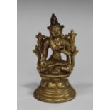 A Sino-Tibetan gilt bronze figure of Tara, probably 20th century, of diminutive form, modelled