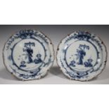 A pair of Japanese Arita blue and white porcelain plates, 18th/19th century, each painted with a
