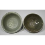 A Chinese celadon glazed bowl, Song dynasty, of circular form with vertical fluting to exterior,