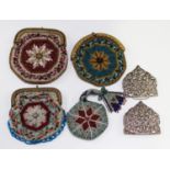 A group of four late 19th century beadwork ladies' purses with gilt metal clasps, together with a
