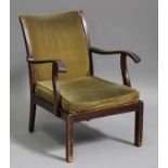 A mid/late 20th century Parker Knoll mahogany framed open armchair, upholstered in green velour,