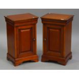 A pair of late 20th century cherrywood bedside cupboards, on bracket feet, height 67cm, width