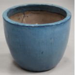 A large modern blue glazed earthenware garden urn of ovoid form, height 44cm, diameter 55cm.Buyer’