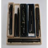 A group of various fountain pens, including two Onoto self-filling pens, a Conway Stewart