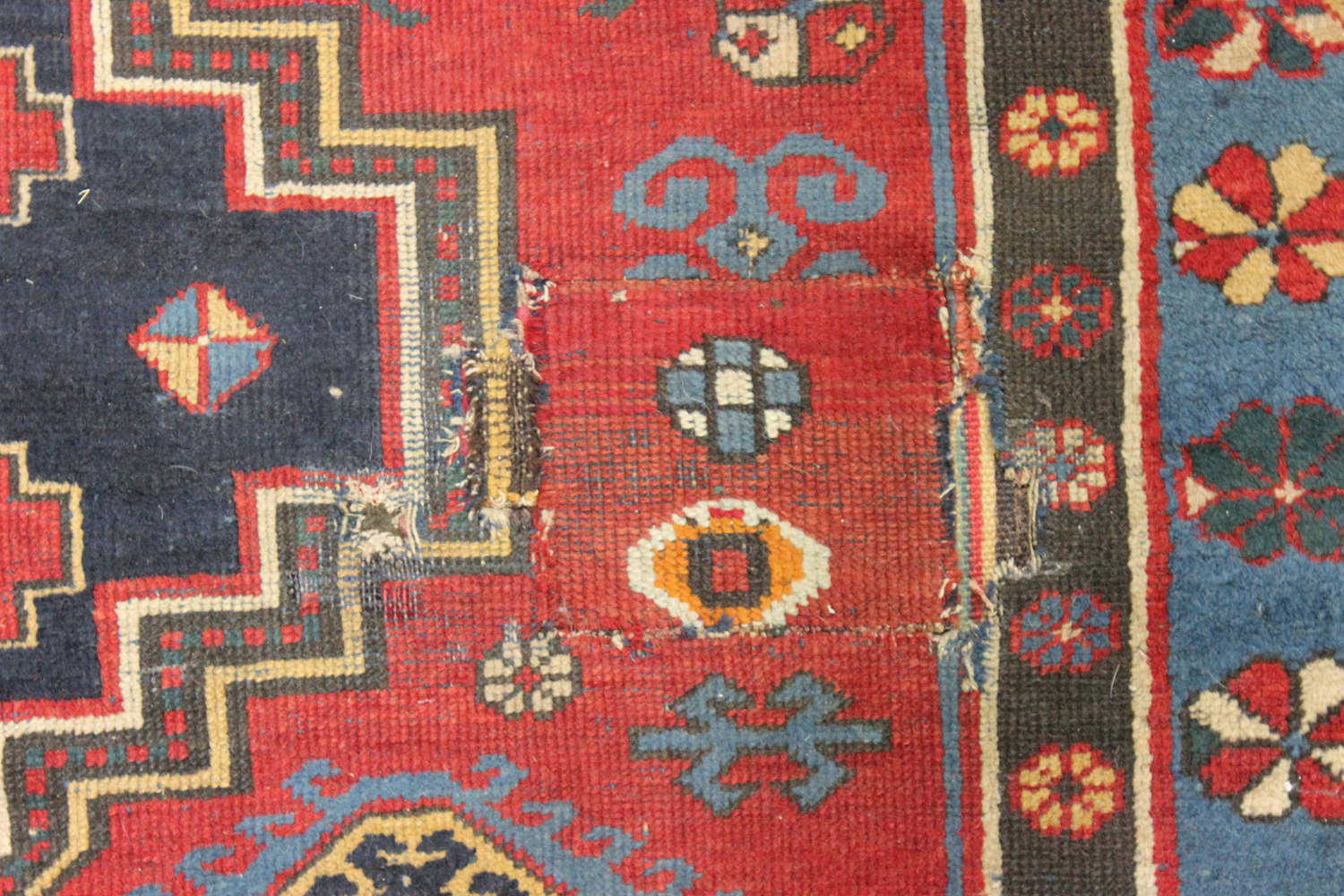 A Kazak rug, West Caucasus, early 20th century, the red field with three large medallions, supported - Image 3 of 4