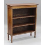 An Edwardian mahogany open fronted bookcase with beaded decoration and two adjustable shelves, on