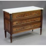 An early 20th century French Louis XVI style figured mahogany and brass mounted commode chest, the