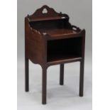A George III mahogany night table, the galleried top fitted with a shelf and pierced with handles,