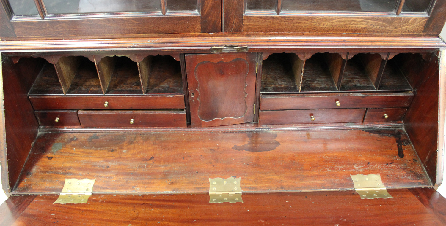 A George III mahogany bureau bookcase, the dentil moulded pediment above a pair of astragal glazed - Image 2 of 2