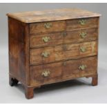 A George I walnut and boxwood line inlaid chest of two short and three graduated long drawers, on