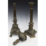 A 19th century cast bronze table lamp, the reeded stem above a flower cusp and a triform base,