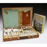 A mid/late 20th century oil painting artist's box, the interior with various oils, palette knives