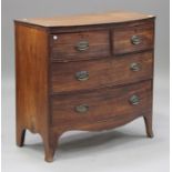 A late George III mahogany bowfront chest of two short and two long drawers, on splayed bracket