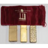 A Dunhill rectangular gilt metal gas lighter with engine turned decoration and two other Dunhill